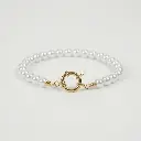 Pulsera con perlas blancas pequeñas 03.webp