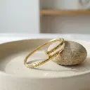 Pulseras cartier forma de clavo dorado 03.webp